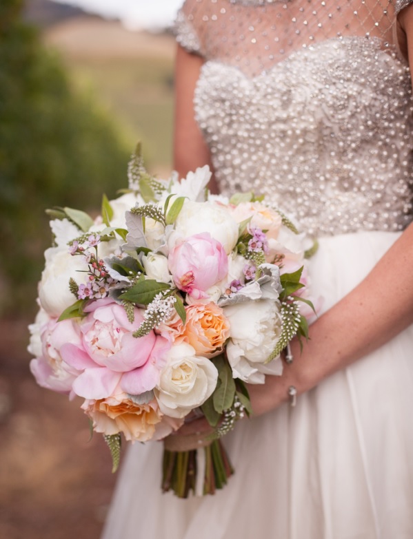 Bride's bouquet with peach and white garden roses and pink and white pionies