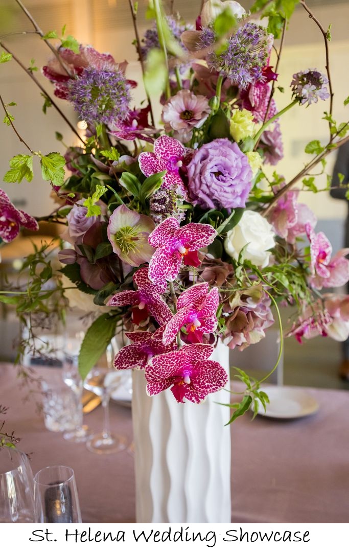 red and white arrangement in white vase