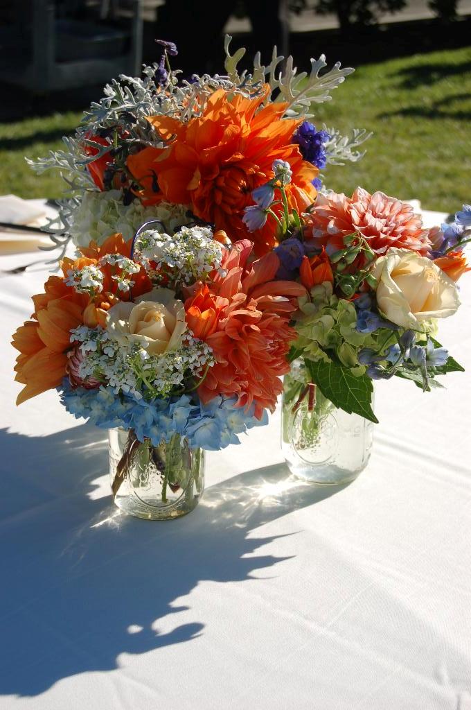 floral arrangement with in orange and blue